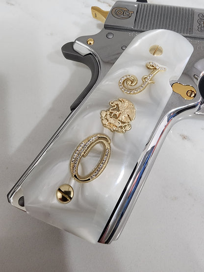 1911 White Pearlite Grips with Gold Plated Mexican Eagle, CZ Crystal “J” & “O” Initials – Fits Full Size Government & Commander 1911 .45 ACP / .38 Super