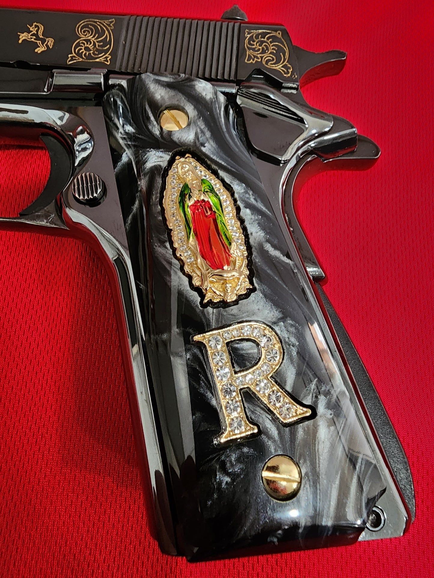 1911 Black Pearlite Virgin Mary Gold Plated 24k & Crystal “R” Grips – .45 ACP / .38 Super (Gold Plated Screws)