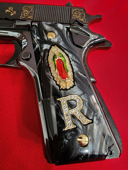 1911 Black Pearlite Virgin Mary Gold Plated 24k & Crystal “R” Grips – .45 ACP / .38 Super (Gold Plated Screws)