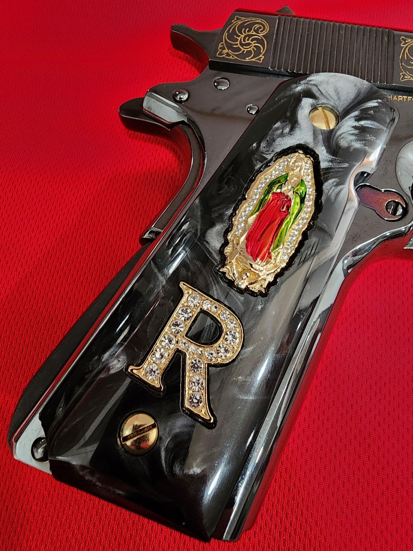 1911 Black Pearlite Virgin Mary Gold Plated 24k & Crystal “R” Grips – .45 ACP / .38 Super (Gold Plated Screws)