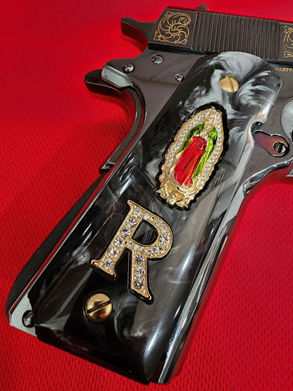 1911 Black Pearlite Virgin Mary Gold Plated 24k & Crystal “R” Grips – .45 ACP / .38 Super (Gold Plated Screws)